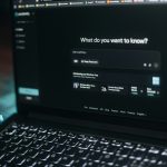 Laptop screen showing a search bar.