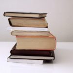 brown hardbound books on black book